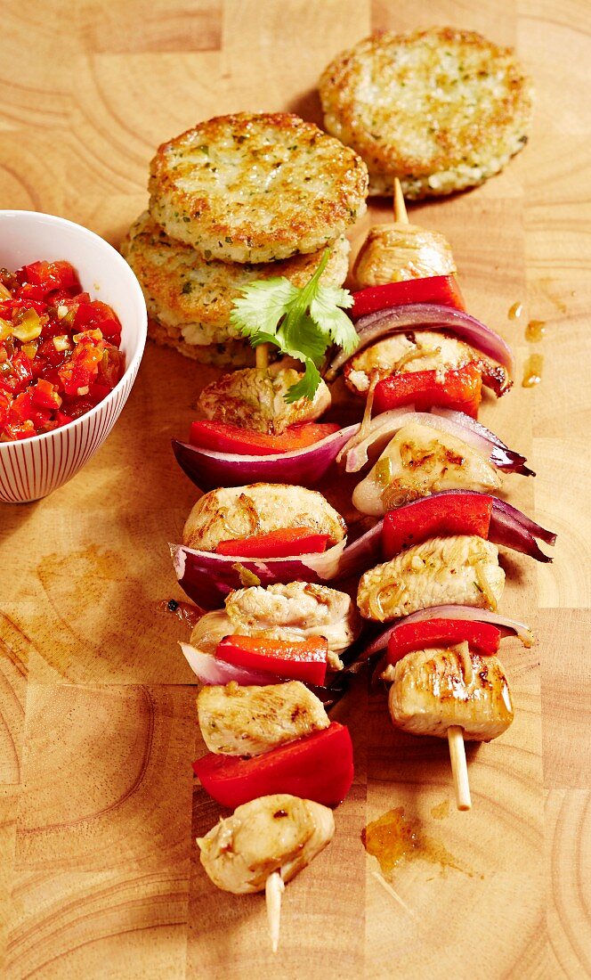 Chicken skewers with fried rice cakes
