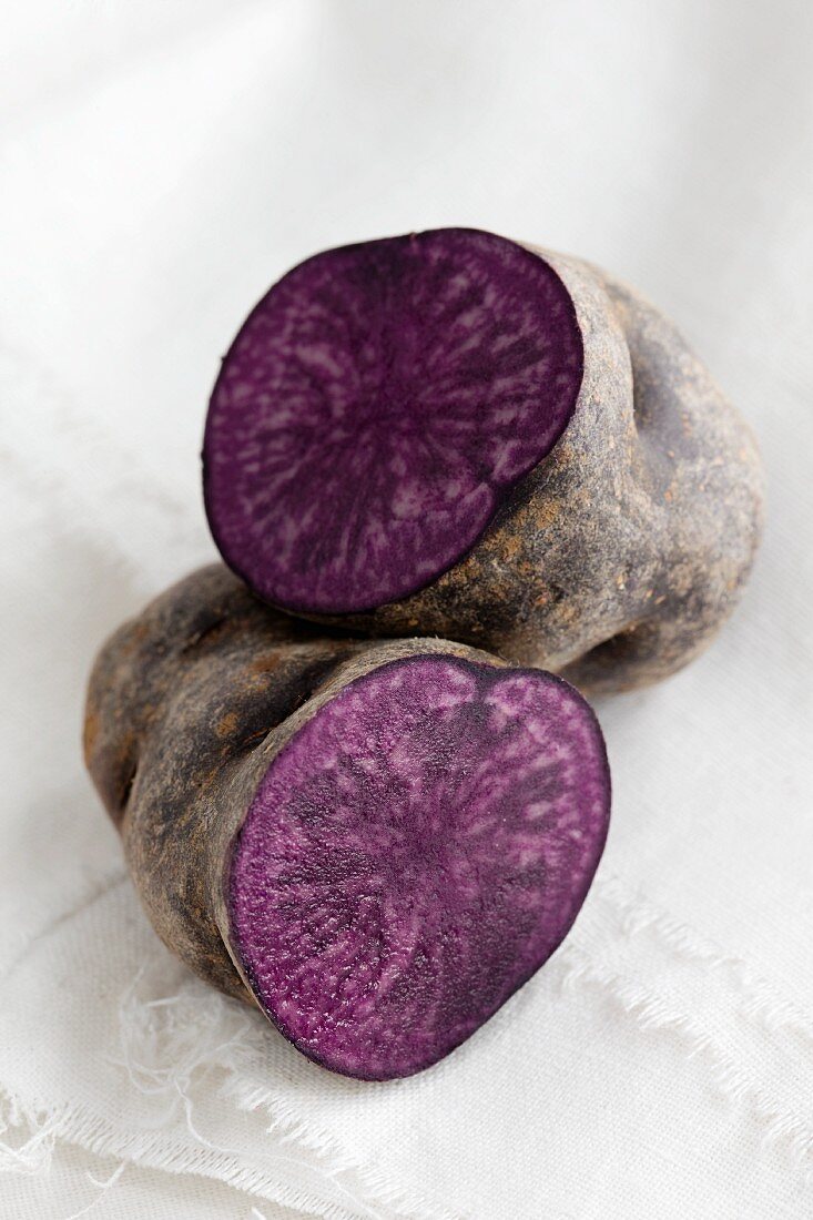 A purple potato, halved
