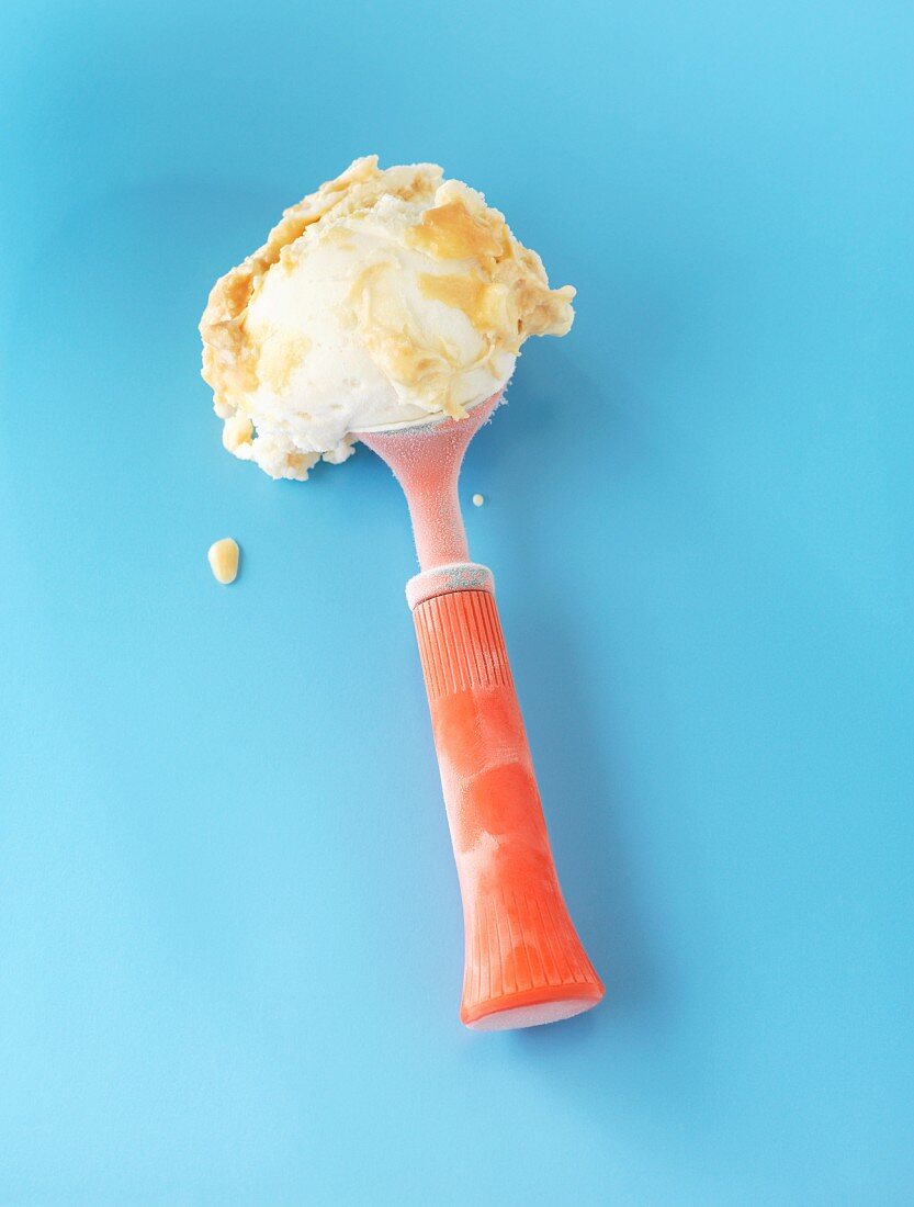 Caramel ice cream in an ice cream scoop