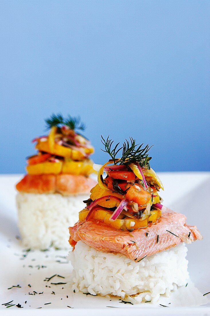Poached salmon fillet served on rice with pickled vegetables