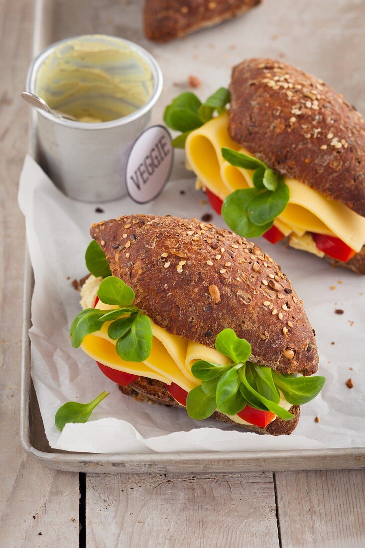 Vegetarian cheese sandwiches with fresh lamb's lettuce