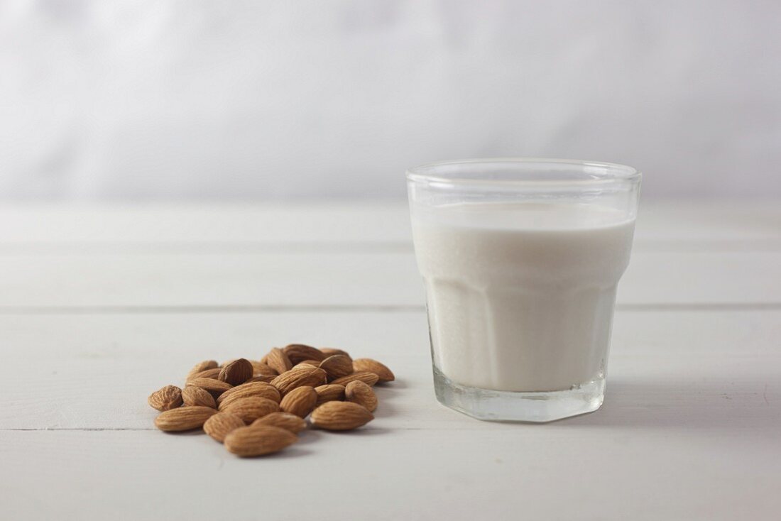 Almonds and a glass of almond milk