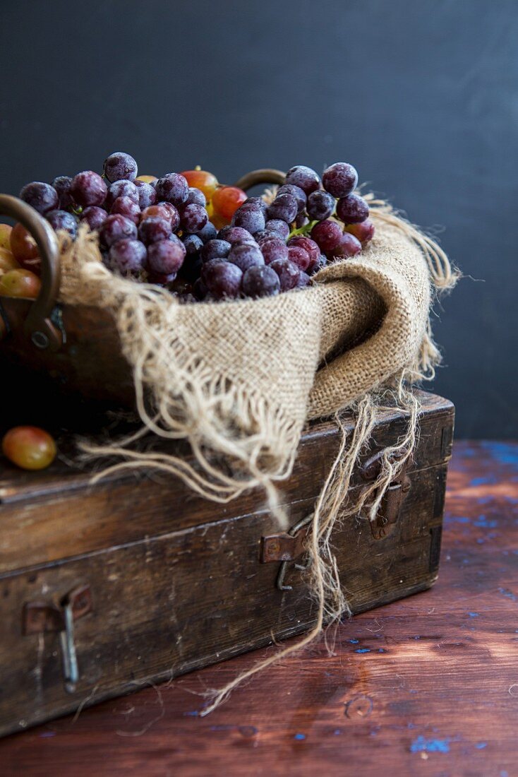 An arrangement of grapes with a piece of jute