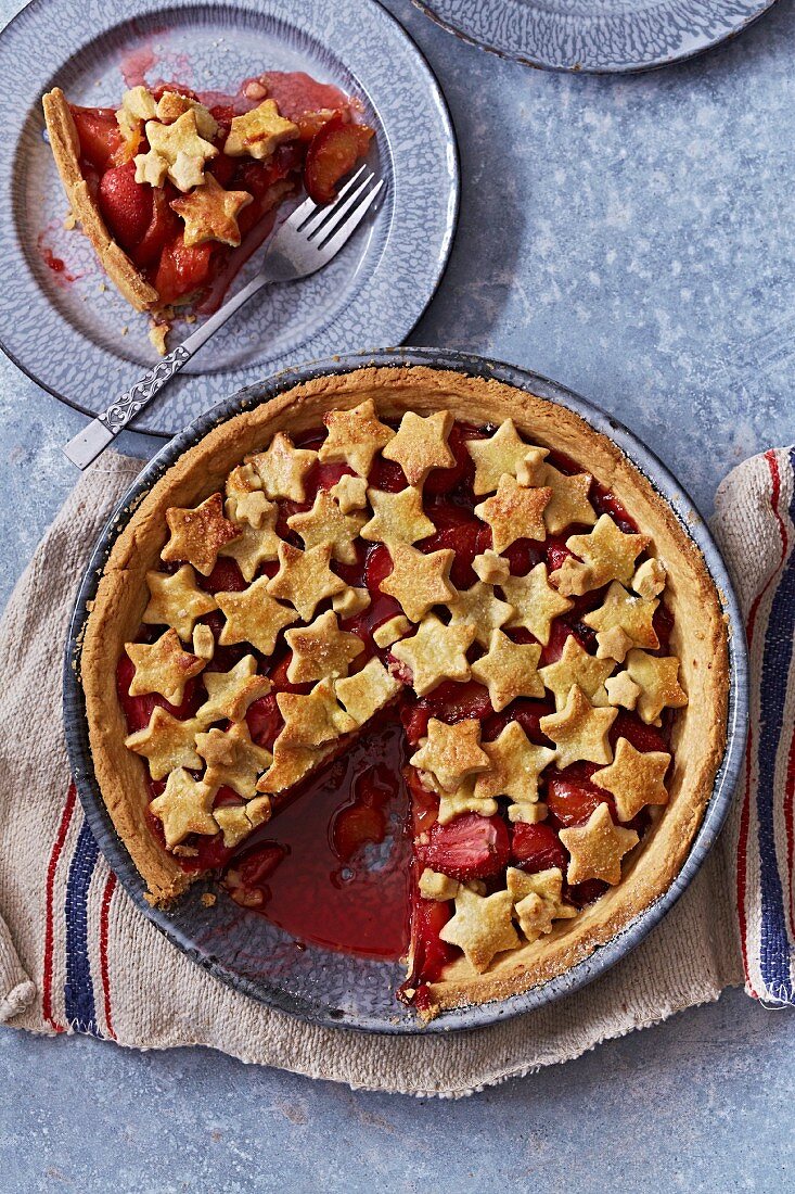 Apple and strawberry pie decorated with shortcrust stars