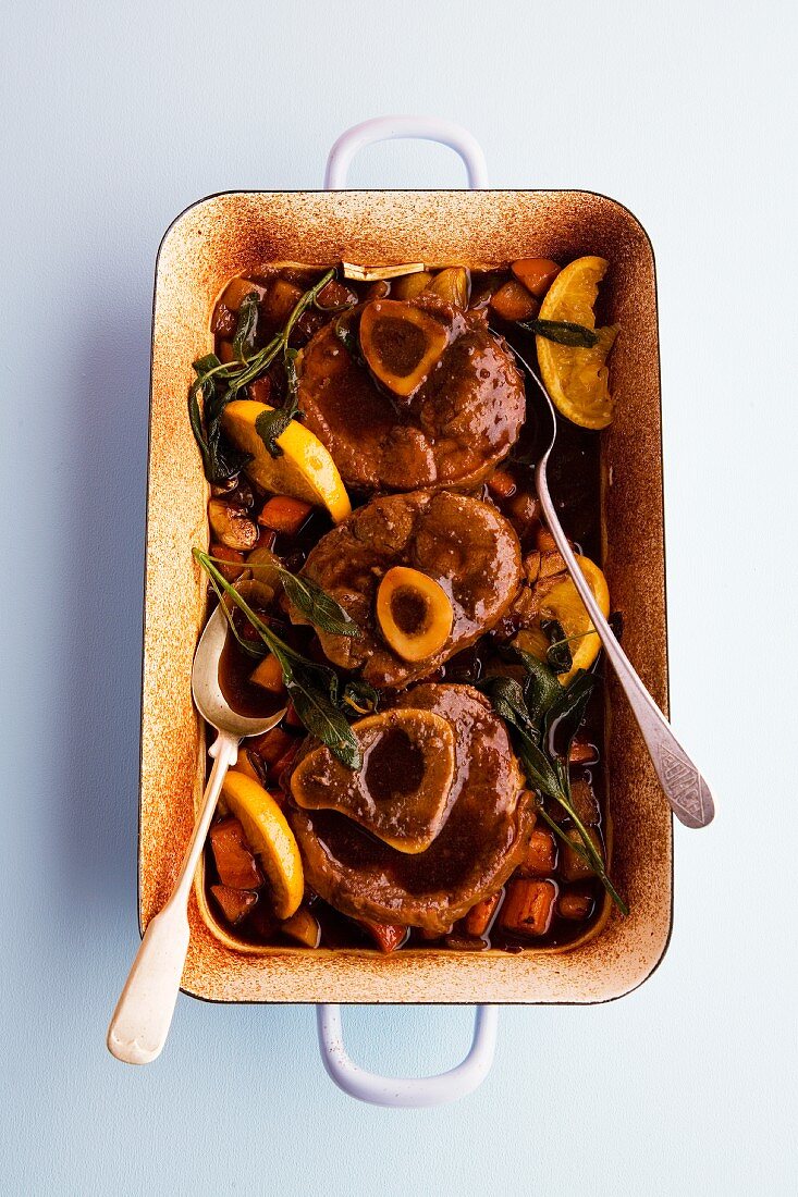 Braised veal knuckle with oranges and sage