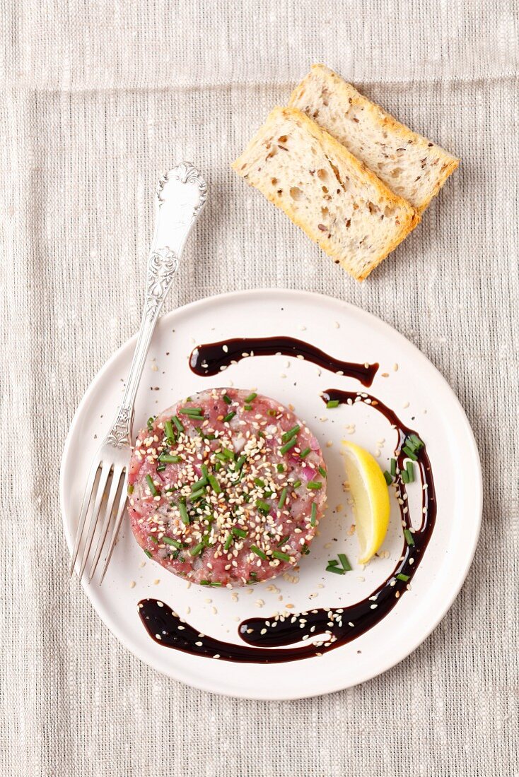 Duck breast tartare with sesame seeds and chives