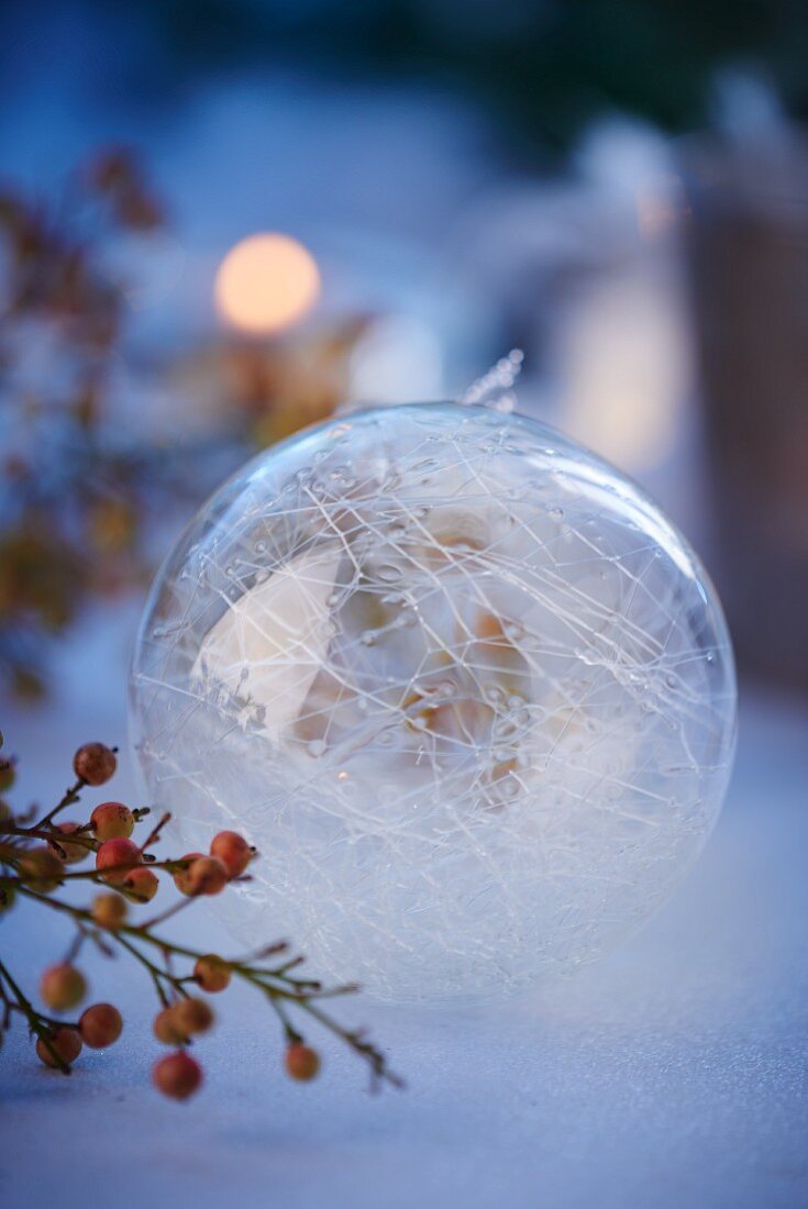 A transparent filigree Christmas bauble as decoration