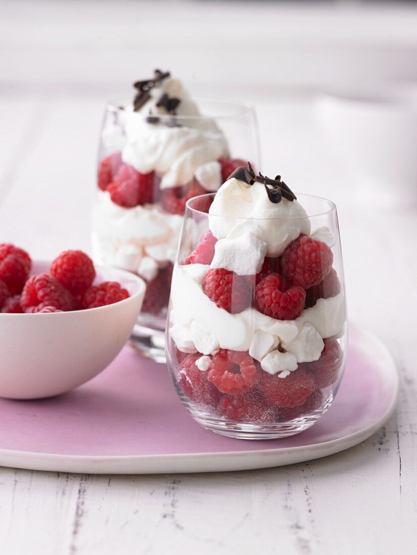 Deserts with frozen raspberries, meringue and cream