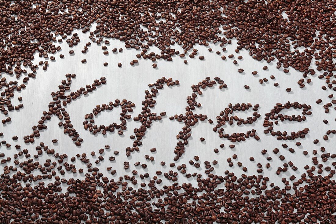 The word 'Kaffee' written in coffee beans