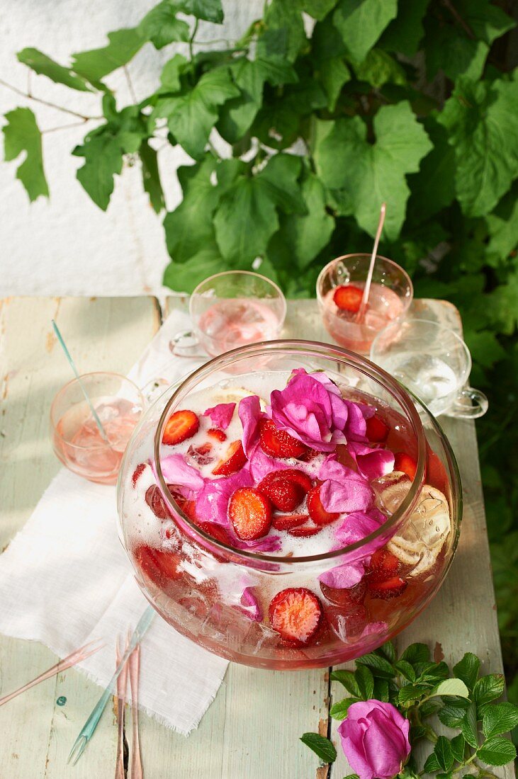 Strawberry and rose punch on a table outside