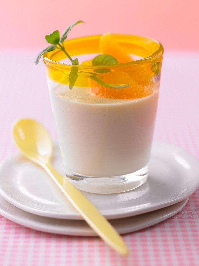 Panna cotta with orange fillets in a desert glass