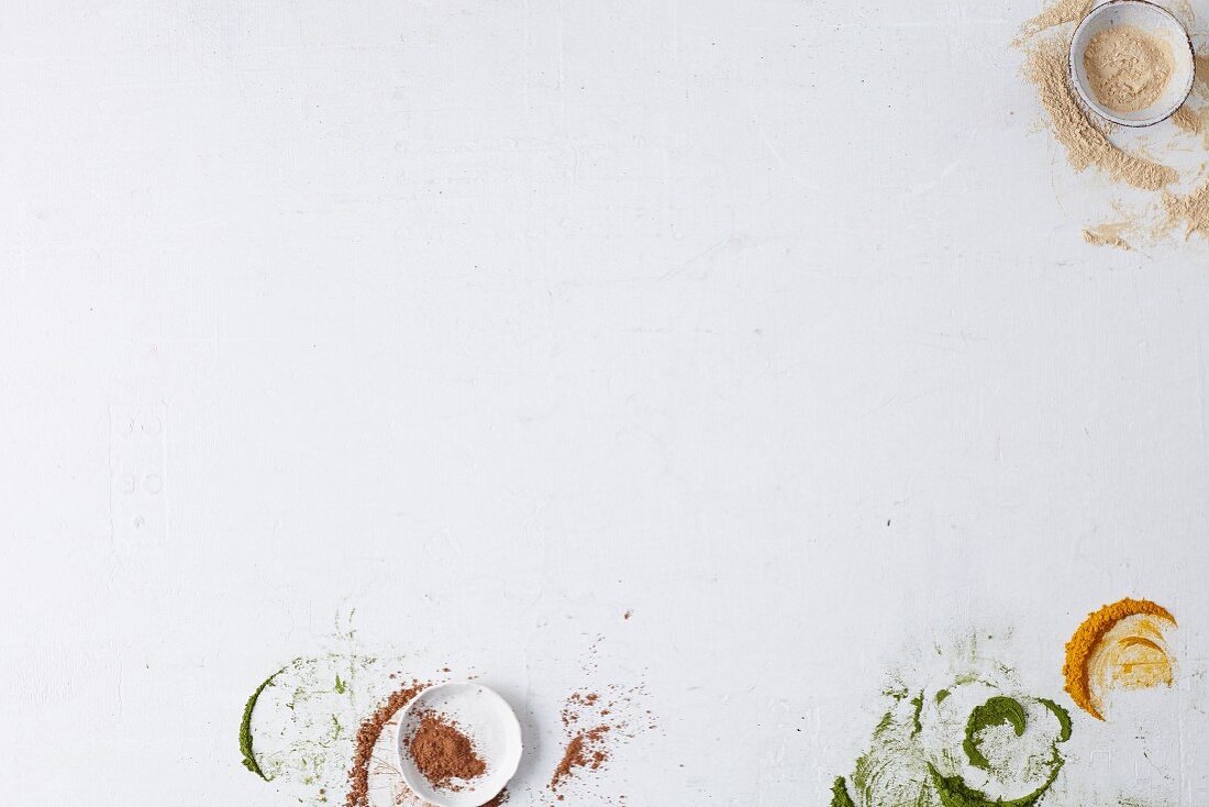 Smears of various spices on a white surface