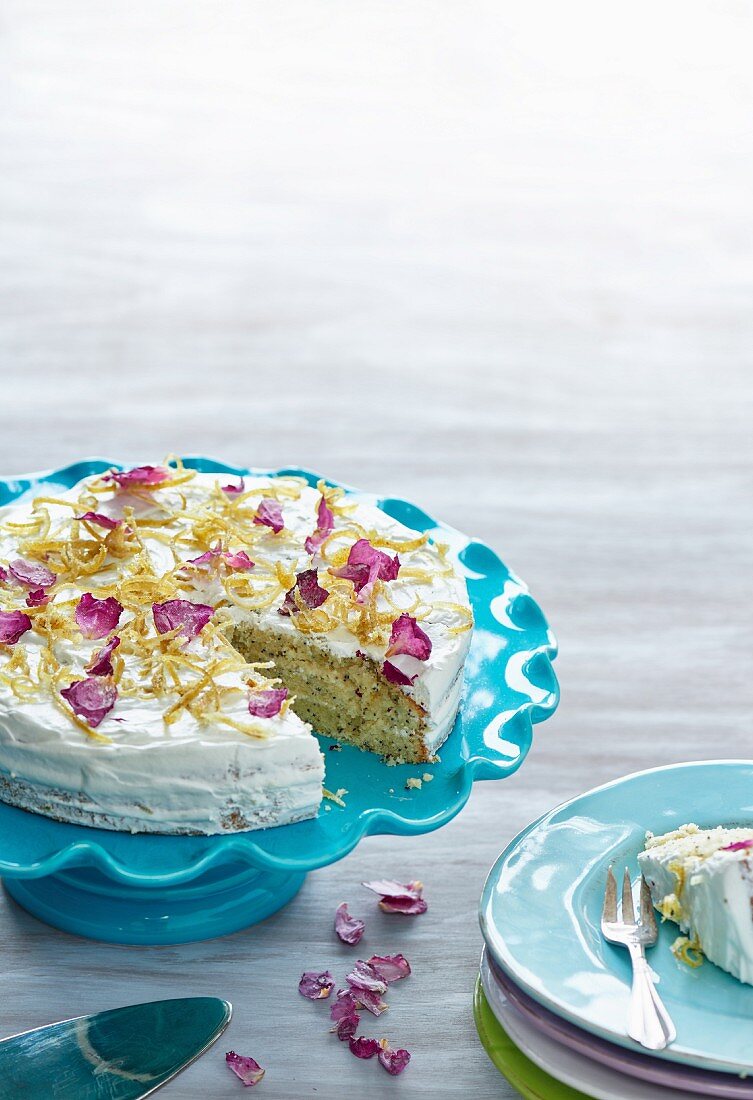 Lemon cake with rose petals, sliced