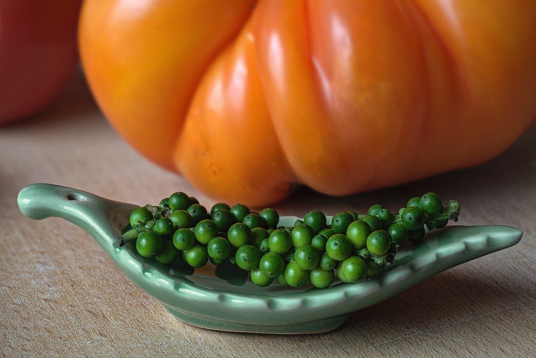 Green peppercorns and a pineapple tomato