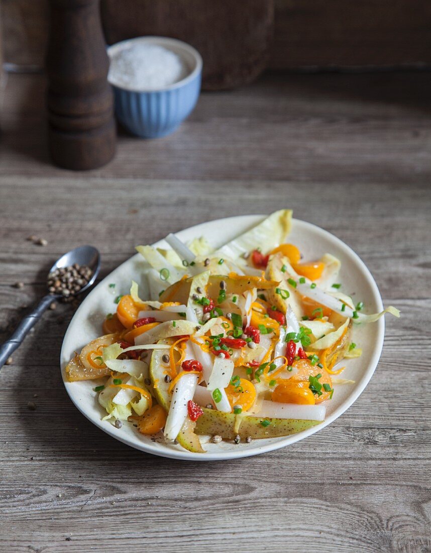 Vegan chicory salad with pears and physalis
