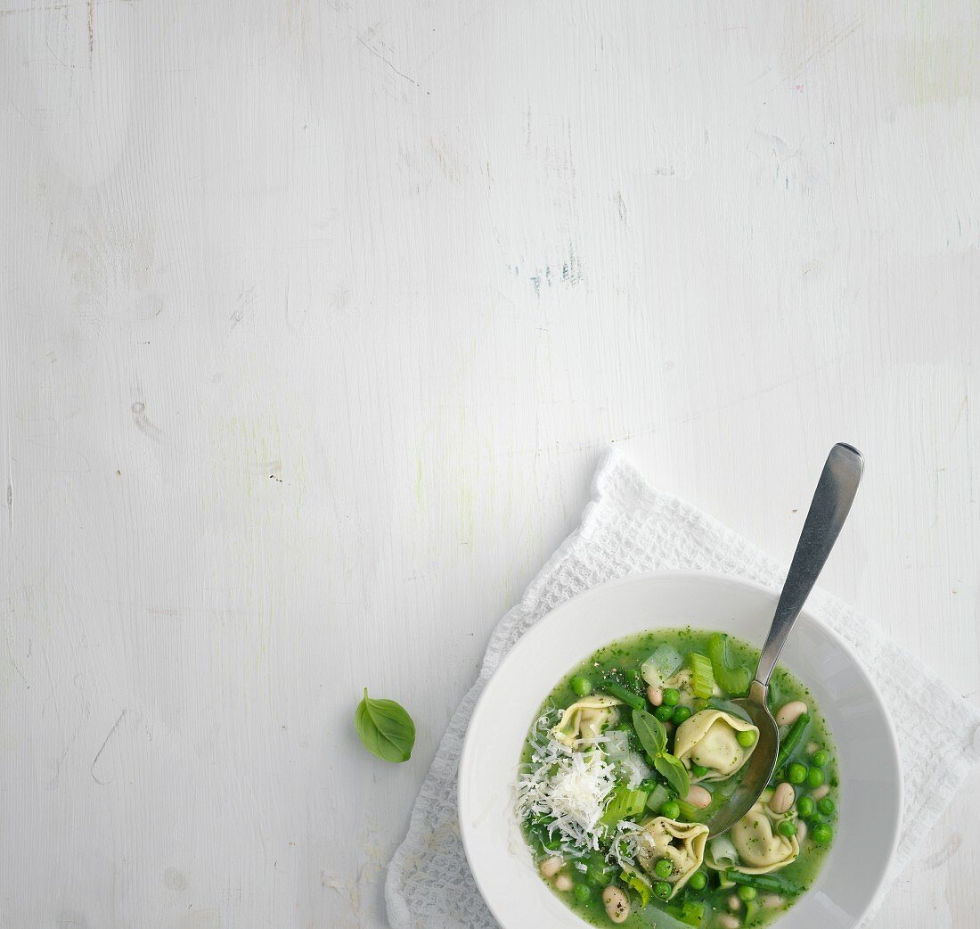 Summer minestrone with green vegetables and tortellini