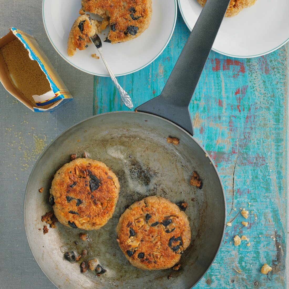Walnut and olive fritters with couscous