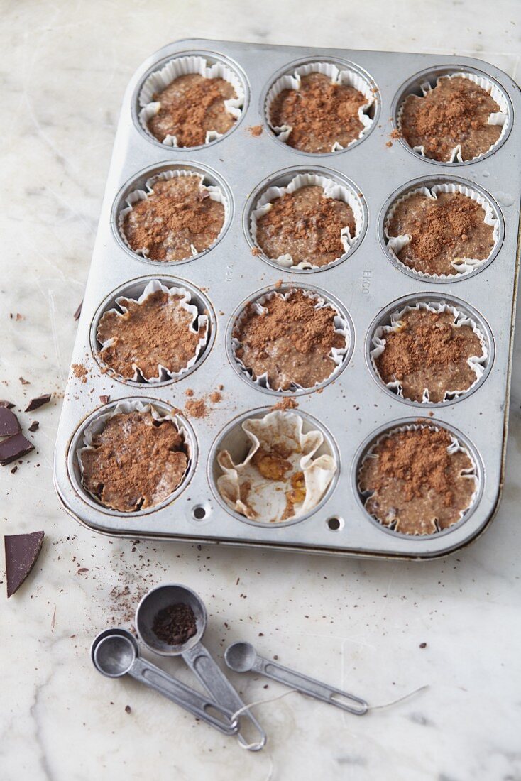 Vegan chocolate and hazelnut tartlets in a muffin tin