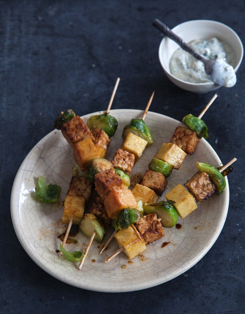 Vegan polenta and Brussels sprouts skewers with tofu remoulade