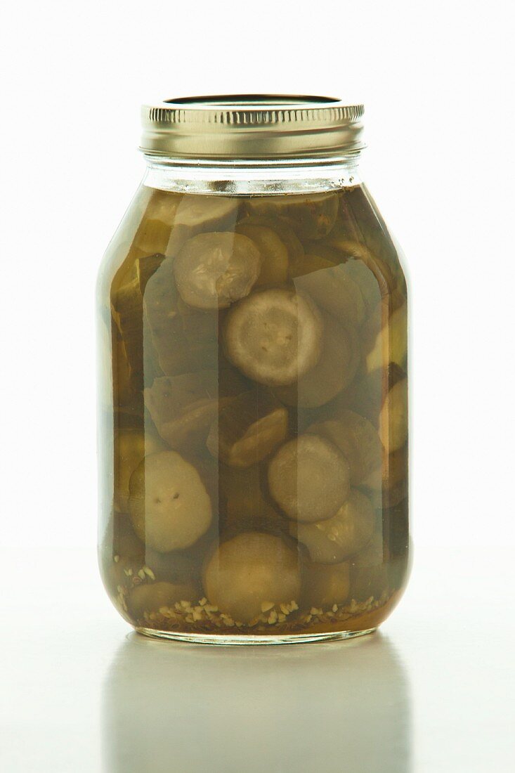 Homemade pickles in a screw-top jar