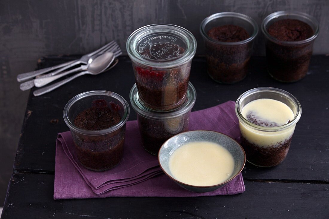Chocolate cake in jars with cherry compote and white chocolate