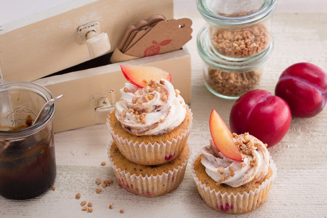 Plum and nut cupcakes with a sour cream topping