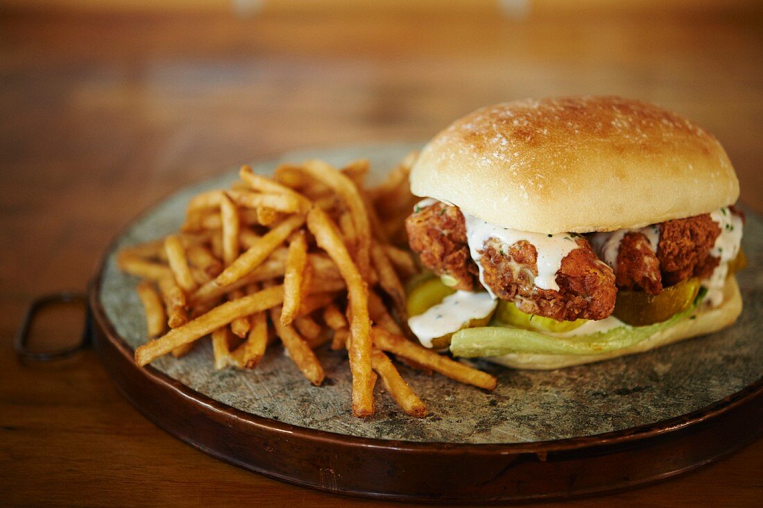 Chicken, horseradish gherkins, cost lettuce and ranch dressing with kefir on an artisan roll