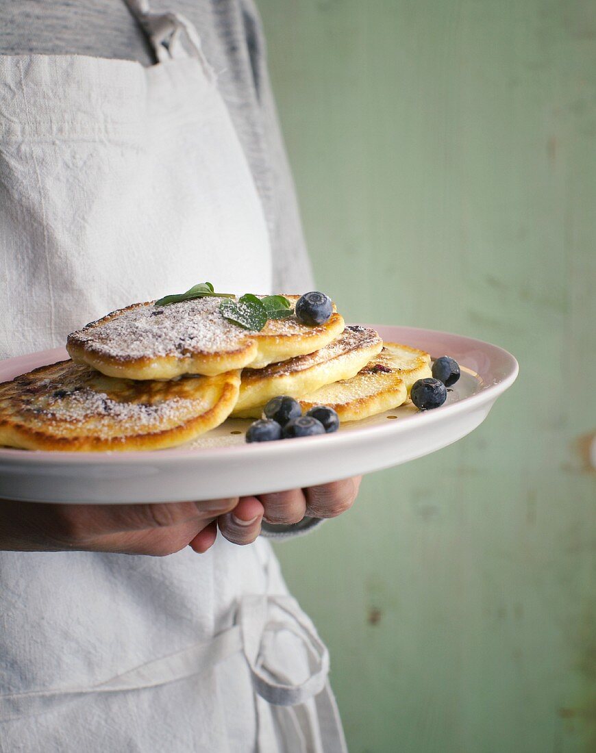 Vegetarian blueberry pancakes with icing sugar