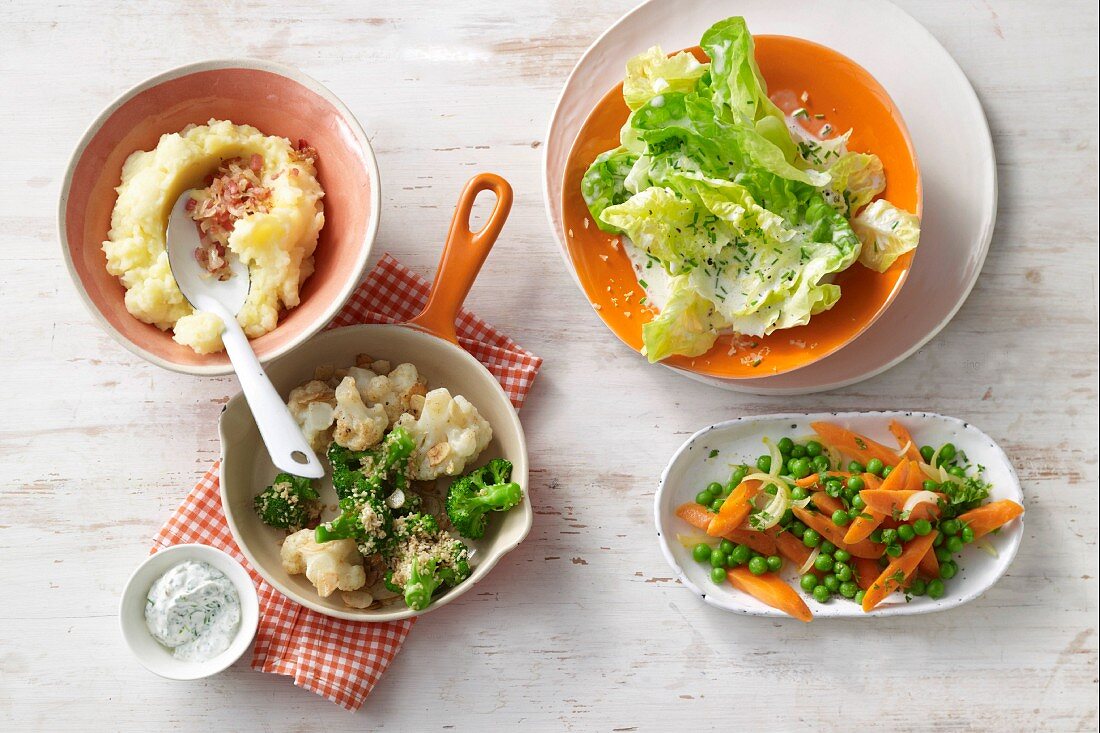 Fried cauliflower and broccoli, peas and carrots, lettuce with a creamy dressing and mashed potatoes with buttermilk