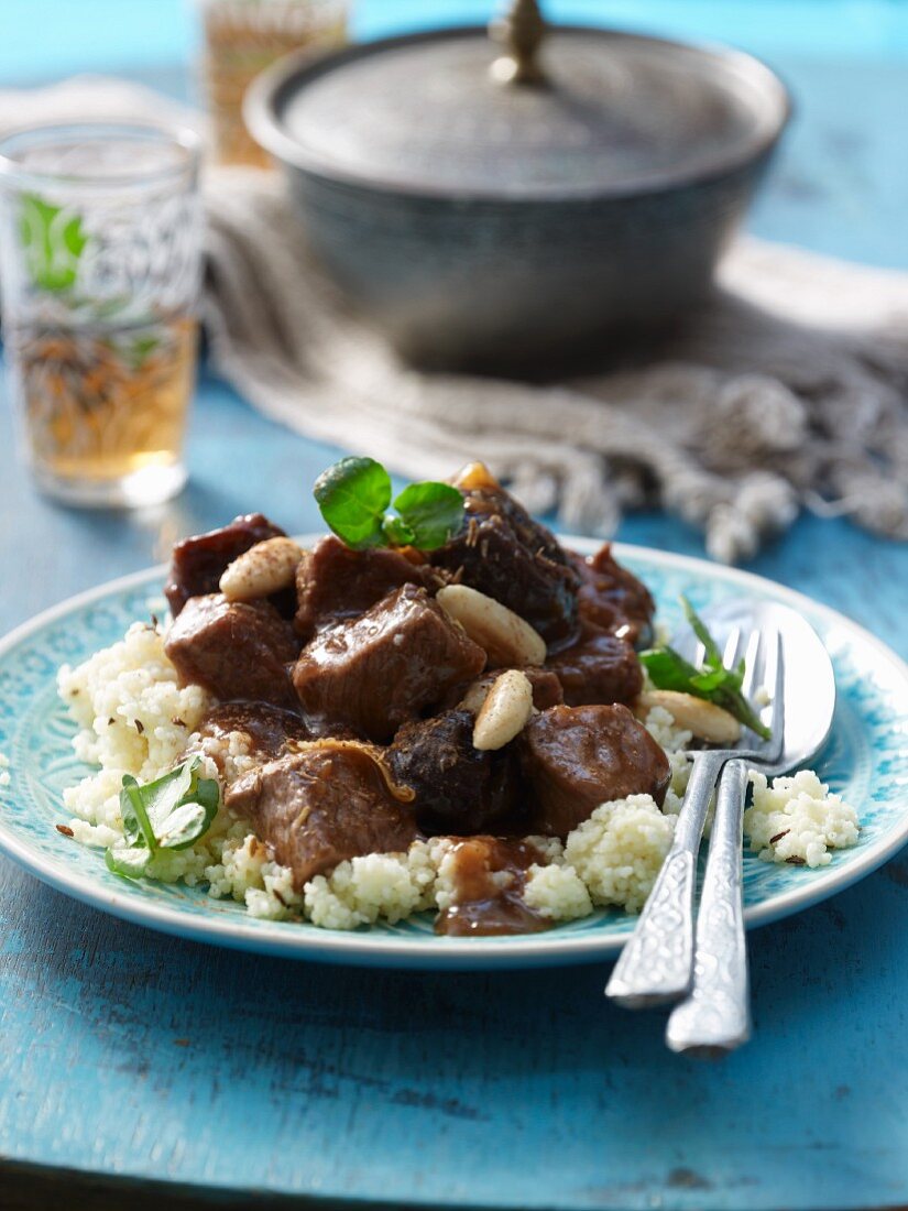 Beef tagine with almonds and baked plums