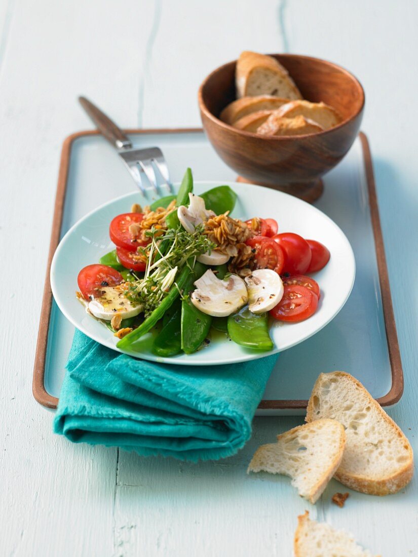 Mange tout salad with tomatoes, mushrooms and cress