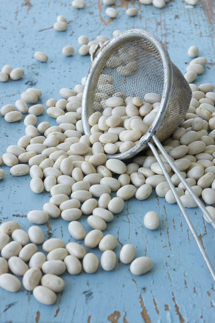 Scattered soya beans with a sieve