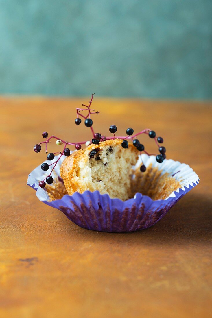 An elderberry muffin with a bite taken out