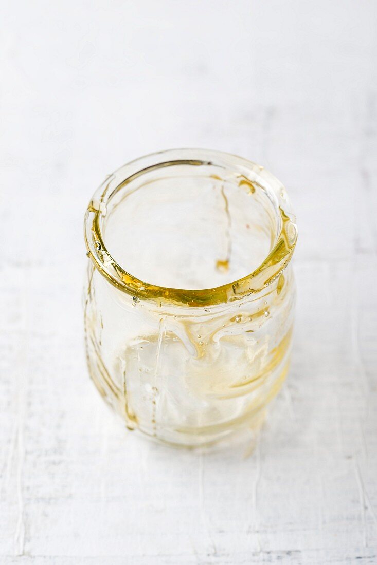 An empty honey jar