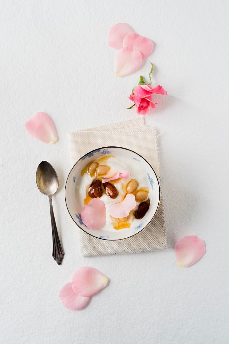 Yoghurt with almonds preserved in honey and rose petals