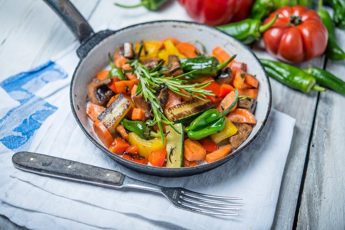 Fried vegetables with mushrooms and rosemary