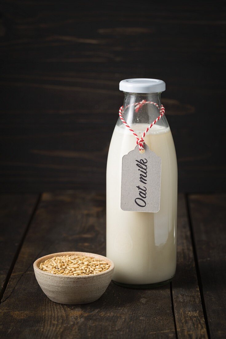 Oat milk in a glass bottle with a label