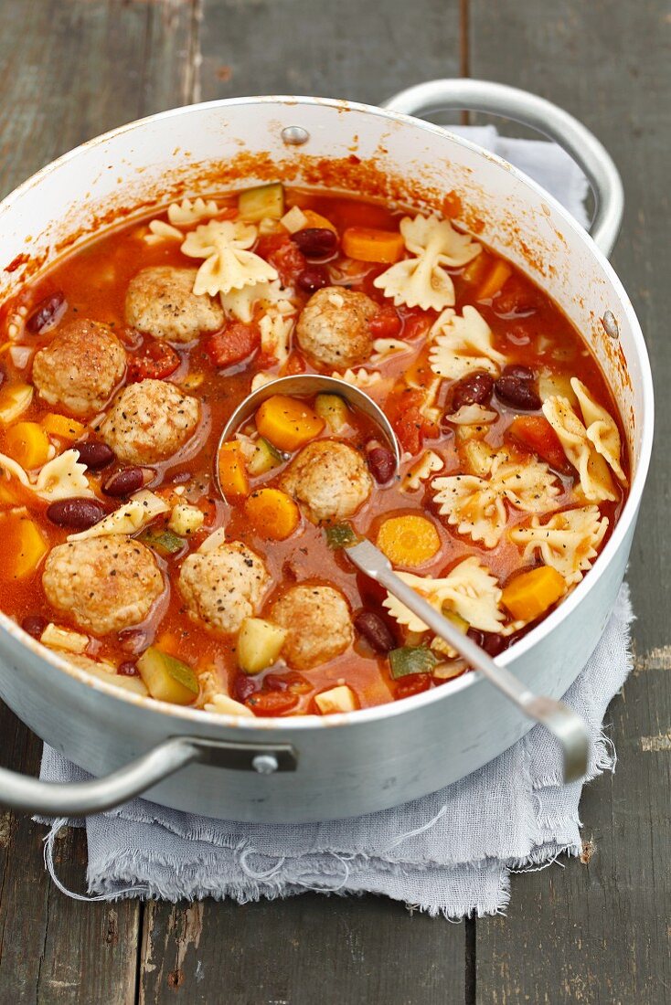 Minestrone with meatballs and farfalle
