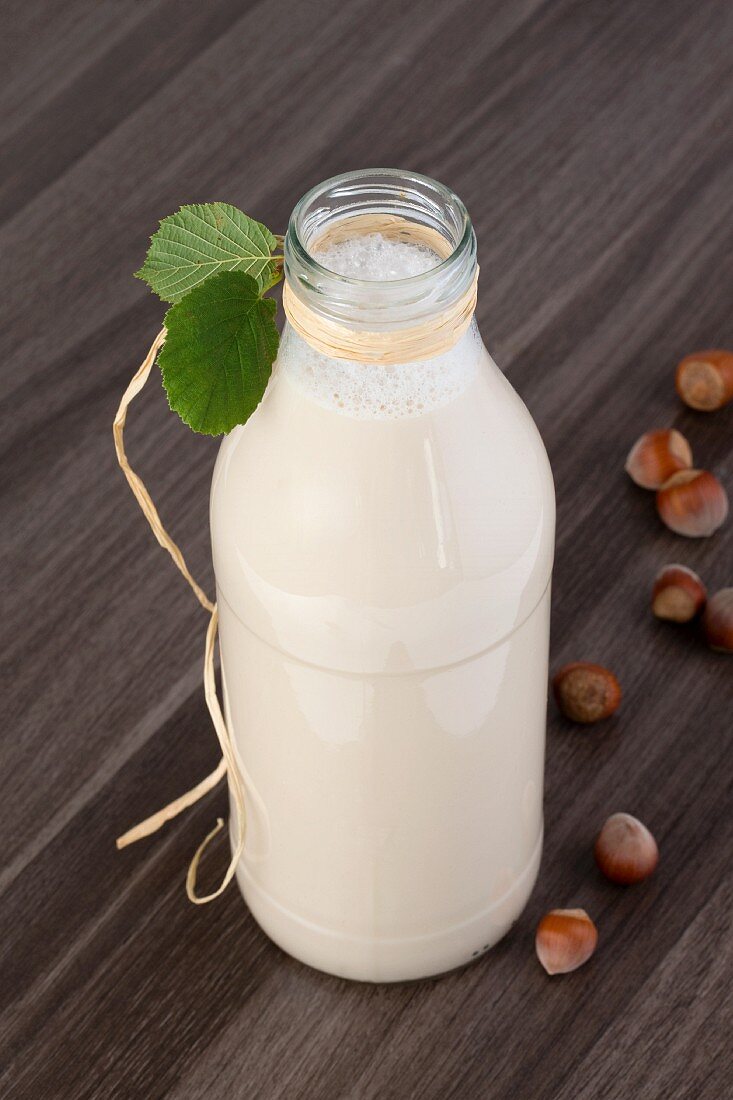 Hazelnut milk in a glass bottle