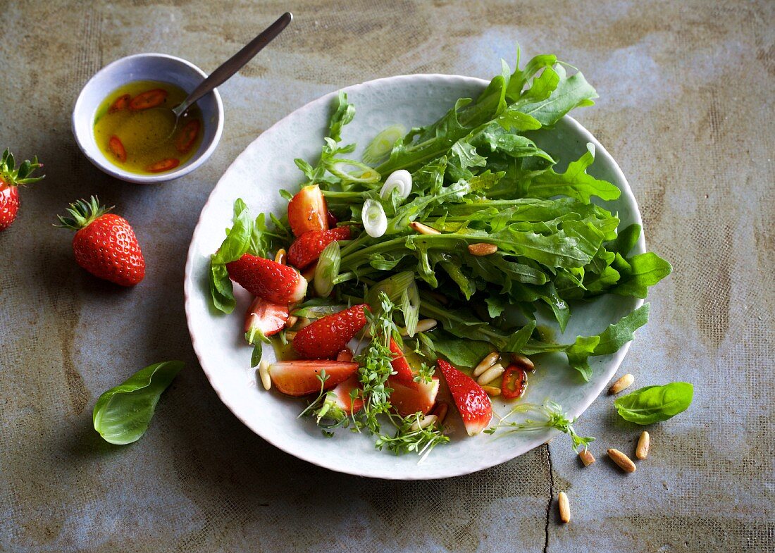 Rocket salad with strawberries and pine nuts