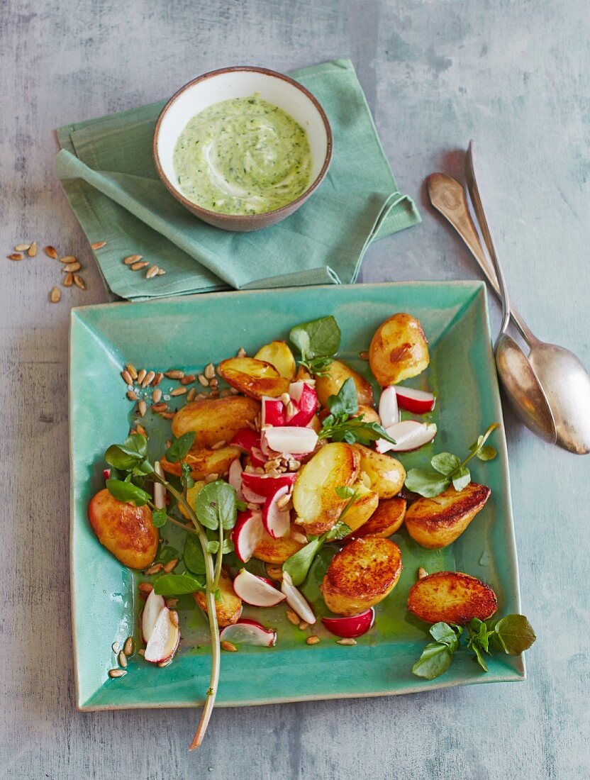 Fried potato salad with water cress and radishes