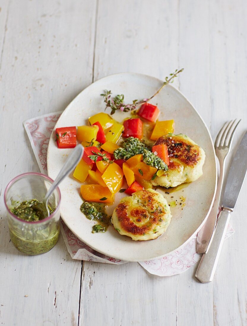 Potato and herb cakes with a pepper medley