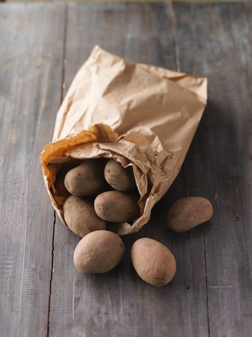 A paper bag of potatoes from a market