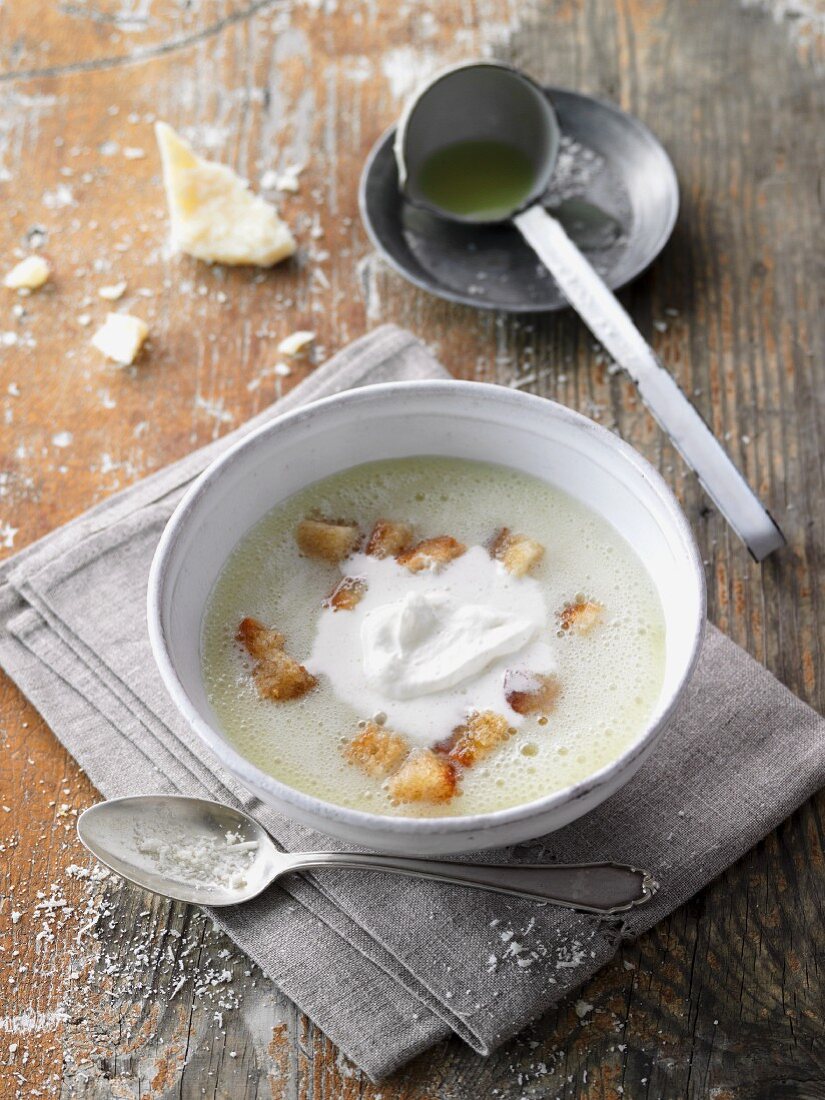 Potato and champagne soup with cream and croutons
