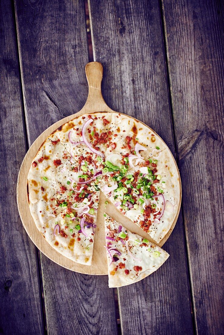 Tarte flambée with bacon and onions