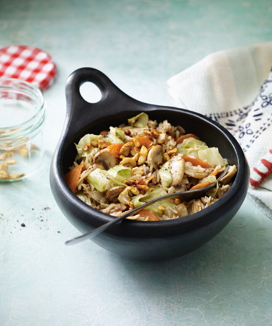 Fried rice with cashew nuts, white cabbage and mushrooms
