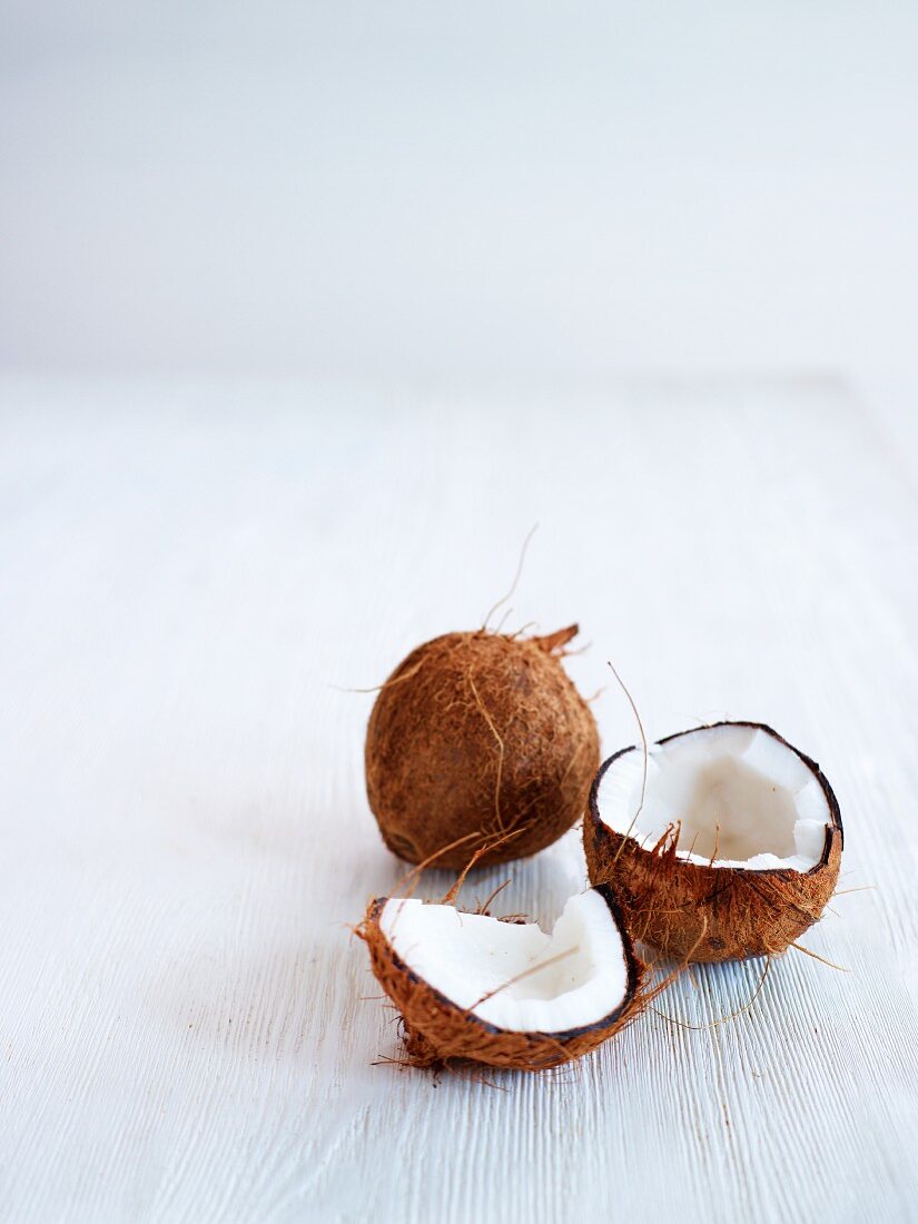 Coconuts, whole and cracked open