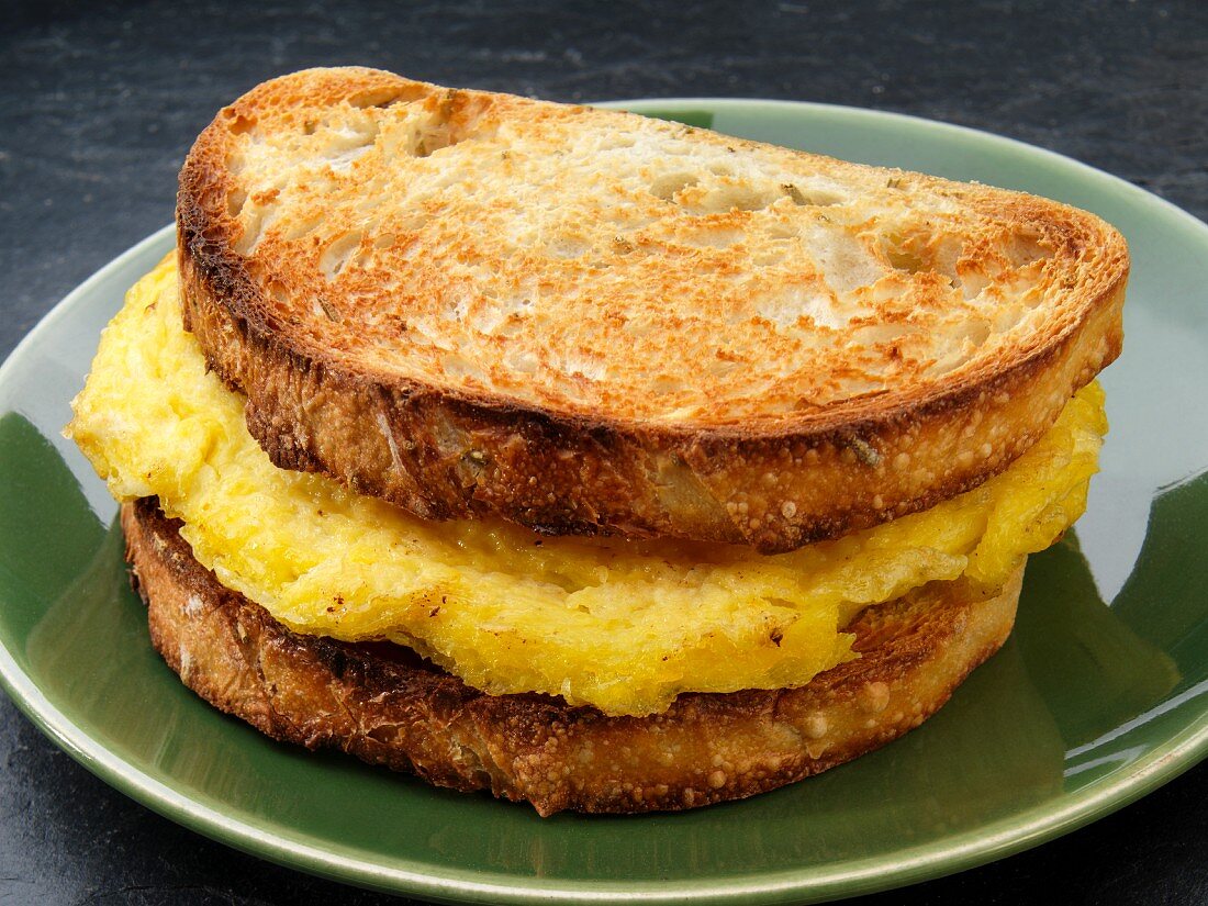 A toasted scrambled egg breakfast sandwich (USA)