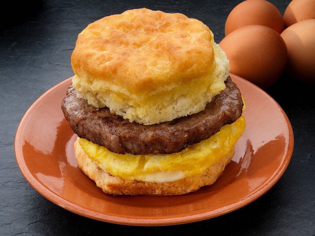 An American biscuit with sausage and scrambled egg (USA)