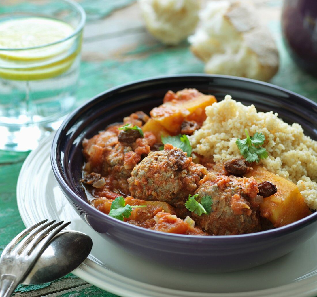 Lamb meatballs in a spicy sauce with couscous